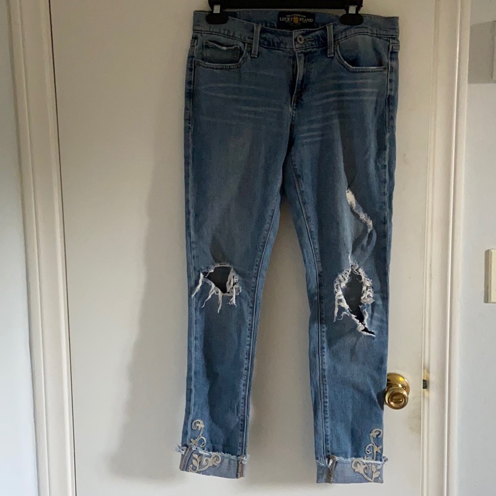 Cute ripped lucky jeans with embroidered flowers